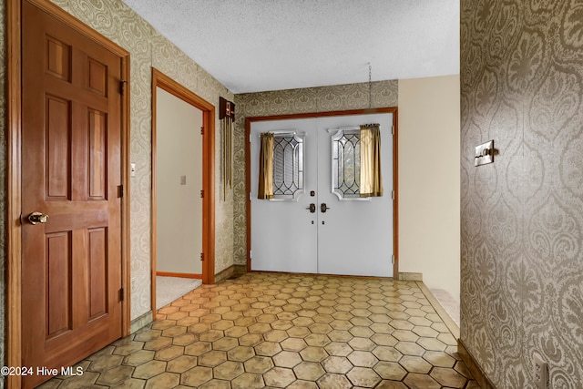 entrance foyer with a textured ceiling