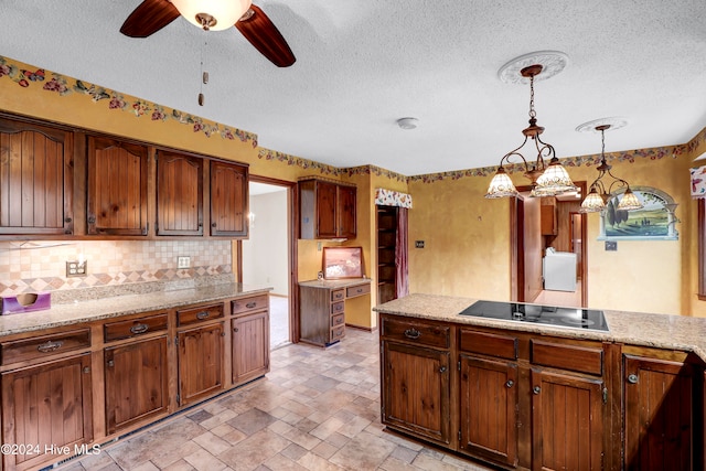 kitchen with ceiling fan, hanging light fixtures, tasteful backsplash, a textured ceiling, and black electric cooktop