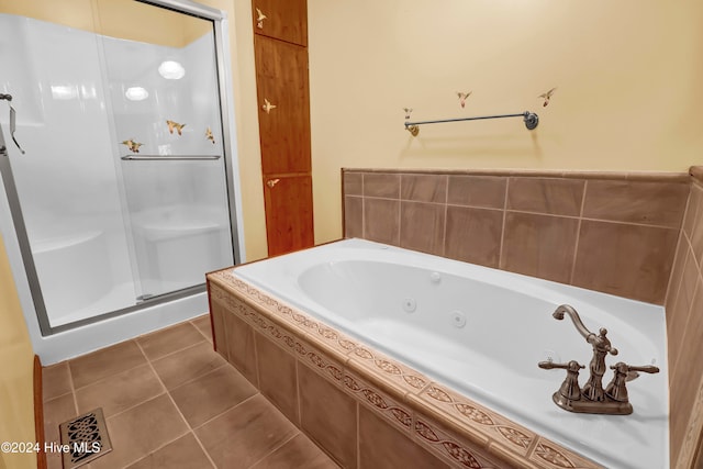 bathroom featuring tile patterned floors and plus walk in shower