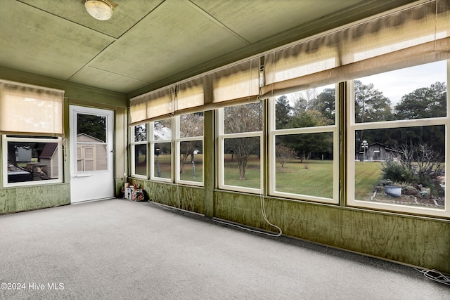 unfurnished sunroom featuring plenty of natural light