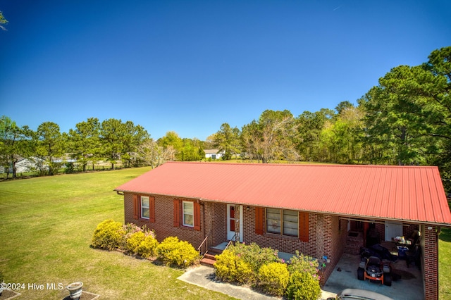 ranch-style home with a front lawn