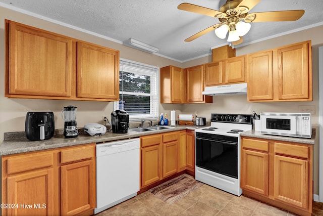 kitchen featuring a textured ceiling, white appliances, crown molding, and sink