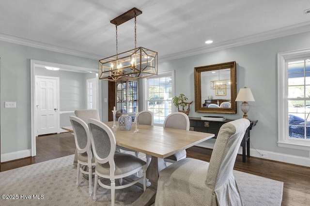 1831 Hawthorne Rd, Wilmington, NC 28403 - dining area featuring a chandelier, baseboards, wood finished floors, crown molding, and recessed lighting