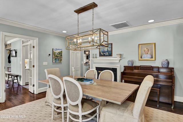 1831 Hawthorne Rd, Wilmington, NC 28403 - dining area with ornamental molding, wood finished floors, recessed lighting, a chandelier, and baseboards