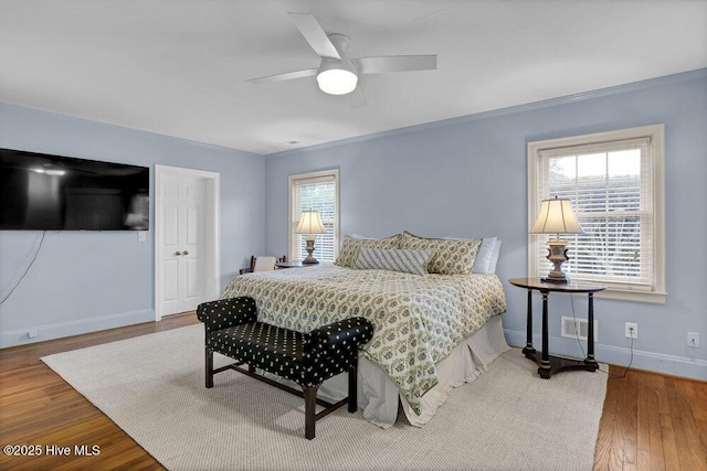 1831 Hawthorne Rd, Wilmington, NC 28403 - bedroom featuring wood finished floors, baseboards, ornamental molding, and ceiling fan