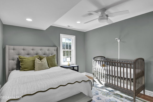 1831 Hawthorne Rd, Wilmington, NC 28403 - bedroom featuring baseboards, wood finished floors, crown molding, recessed lighting, and a ceiling fan