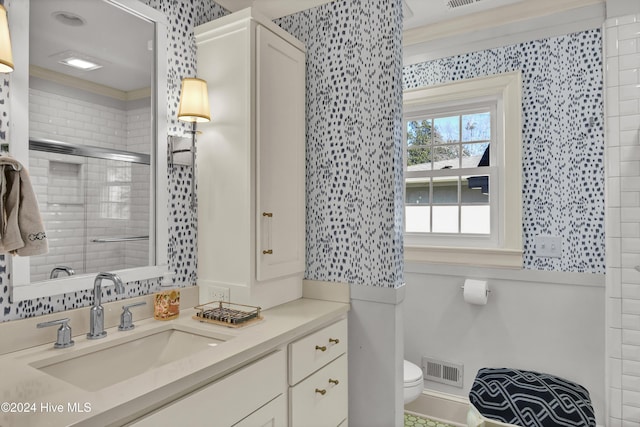 1831 Hawthorne Rd, Wilmington, NC 28403 - bathroom with toilet, vanity, a shower with door, and wallpapered walls