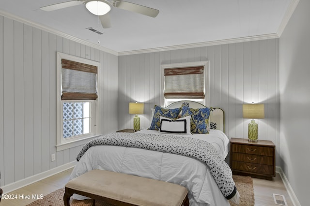 1831 Hawthorne Rd, Wilmington, NC 28403 - bedroom featuring ornamental molding, light wood-type flooring, baseboards, and a ceiling fan