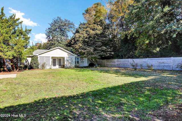 view of yard featuring french doors