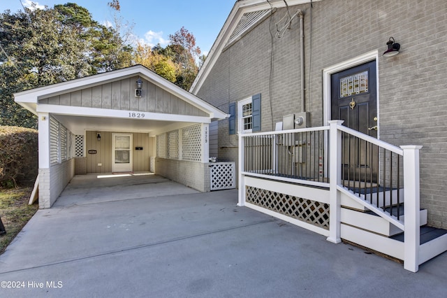 1831 Hawthorne Rd, Wilmington, NC 28403 - entrance to property with driveway, brick siding, board and batten siding, and an attached carport
