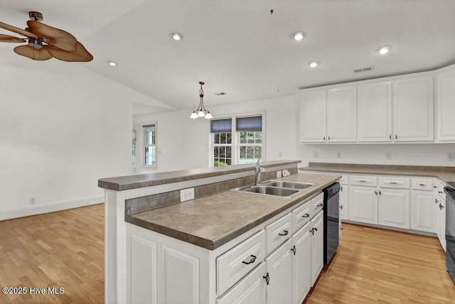 1831 Hawthorne Rd, Wilmington, NC 28403 - kitchen featuring a sink, dishwasher, white cabinets, lofted ceiling, and recessed lighting