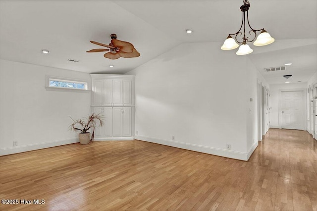 1831 Hawthorne Rd, Wilmington, NC 28403 - unfurnished room with lofted ceiling, ceiling fan, light wood-type flooring, a chandelier, and baseboards