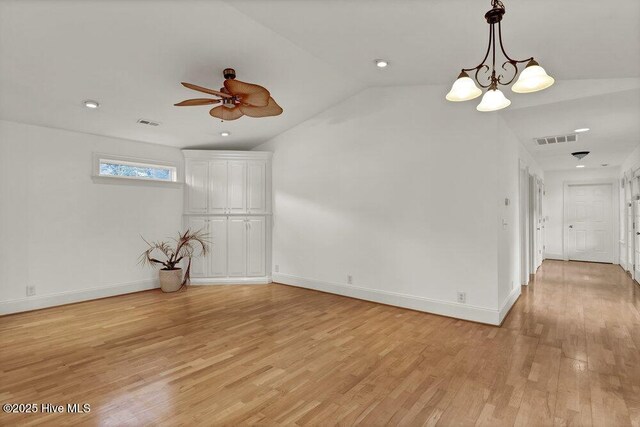 living room with ceiling fan, lofted ceiling, and light hardwood / wood-style flooring