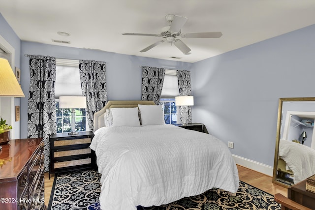 1831 Hawthorne Rd, Wilmington, NC 28403 - bedroom with wood finished floors, baseboards, and a ceiling fan