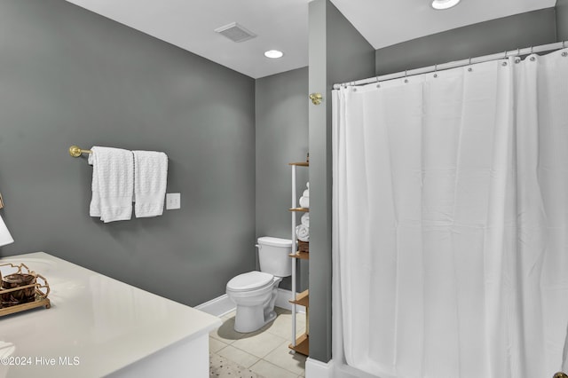 1831 Hawthorne Rd, Wilmington, NC 28403 - full bath with toilet, vanity, tile patterned flooring, baseboards, and recessed lighting