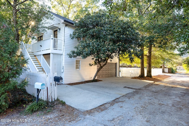 view of side of home with a garage