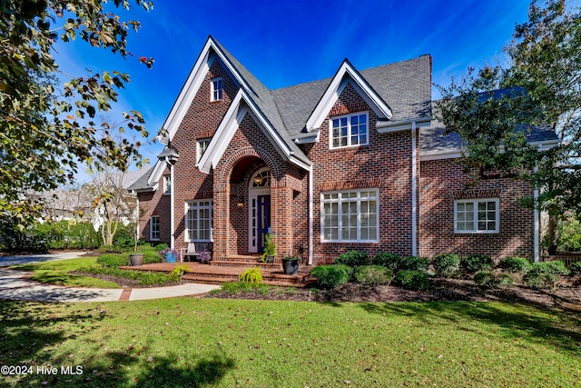 tudor house with a front lawn