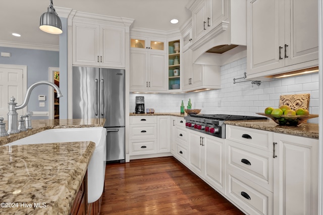 kitchen featuring white cabinetry, dark wood-type flooring, hanging light fixtures, and appliances with stainless steel finishes