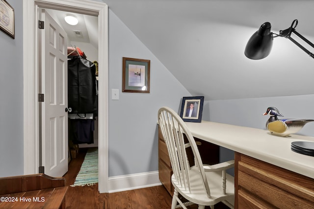 home office featuring dark hardwood / wood-style flooring and lofted ceiling