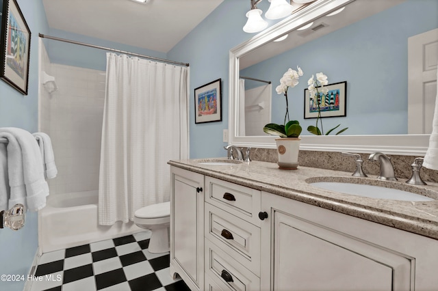 full bathroom with vanity, toilet, and shower / tub combo