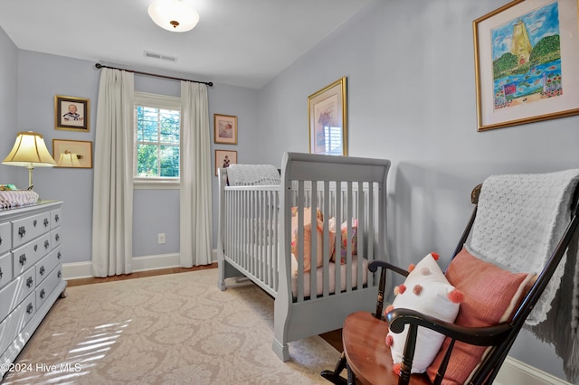 bedroom with a nursery area