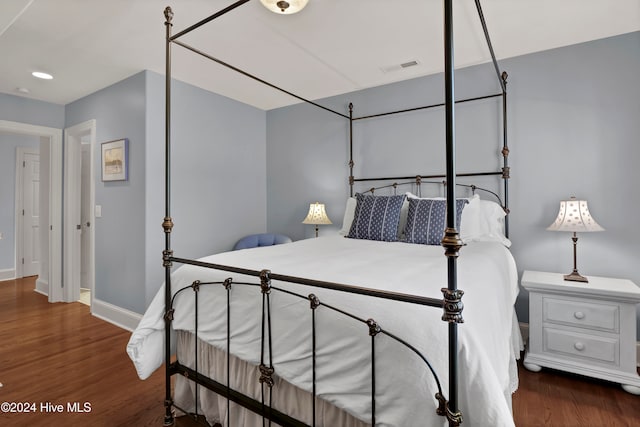 bedroom featuring dark hardwood / wood-style floors