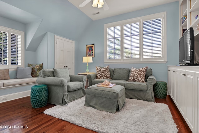 living room with dark hardwood / wood-style floors, vaulted ceiling, and ceiling fan