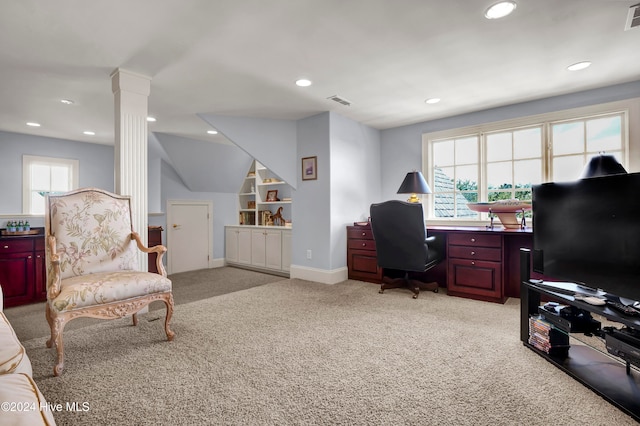 carpeted home office with ornate columns