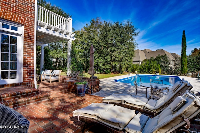 view of swimming pool featuring outdoor lounge area and a patio area