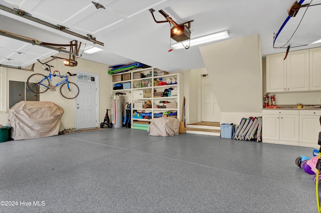 garage featuring a garage door opener and gas water heater