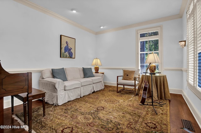 living room with crown molding and dark wood-type flooring