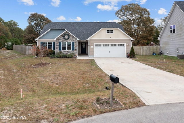 view of front of home featuring a garage and a front lawn