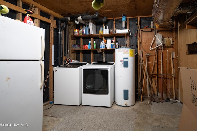 washroom with washing machine and dryer and electric water heater