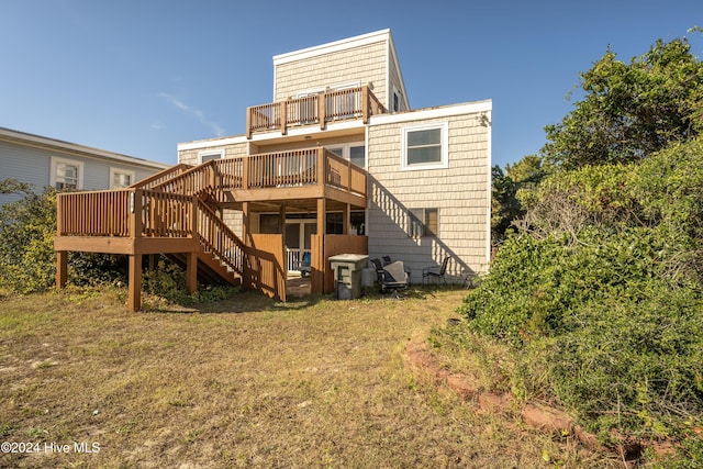 714 Ocean Blvd, Topsail Beach, NC 28445 - rear view of property with stairway, a deck, a lawn, and a balcony