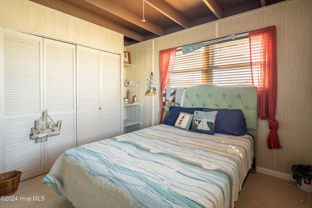 714 Ocean Blvd, Topsail Beach, NC 28445 - carpeted bedroom with a closet and beamed ceiling