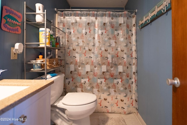 bathroom with tile patterned floors, vanity, curtained shower, and toilet