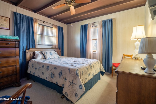 bedroom featuring beam ceiling, ceiling fan, and light carpet