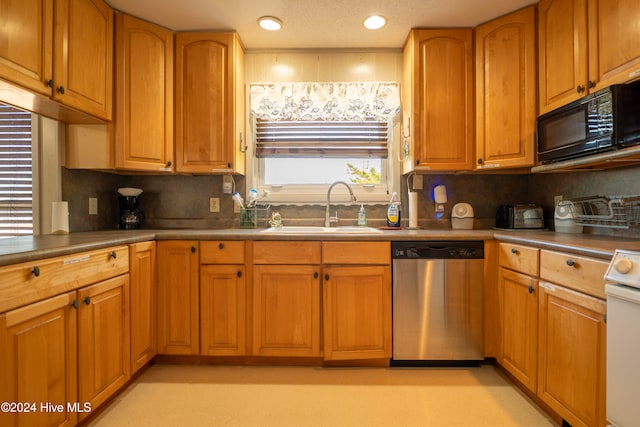 kitchen featuring sink, tasteful backsplash, stainless steel dishwasher, a textured ceiling, and white stove