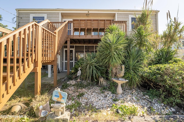 714 Ocean Blvd, Topsail Beach, NC 28445 - rear view of house with stairs and a wooden deck