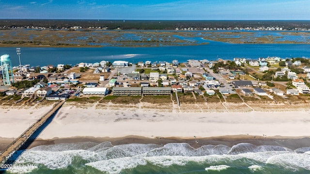 aerial view with a water view and a view of the beach