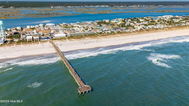 birds eye view of property with a view of the beach and a water view