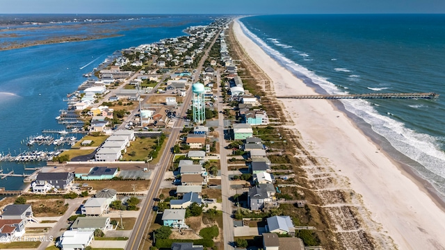 drone / aerial view with a water view and a beach view