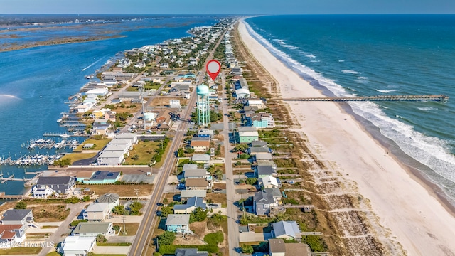 bird's eye view with a water view and a view of the beach