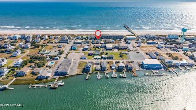 drone / aerial view with a water view and a view of the beach