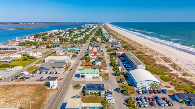 drone / aerial view featuring a view of the beach and a water view