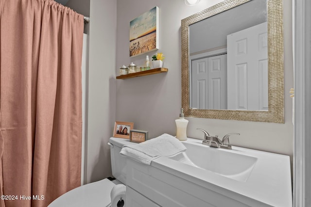 bathroom with vanity and toilet