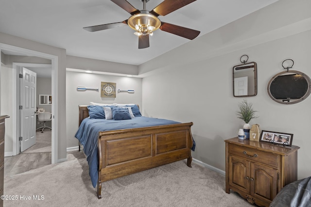 bedroom with ceiling fan and light carpet