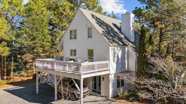 rear view of house featuring a deck