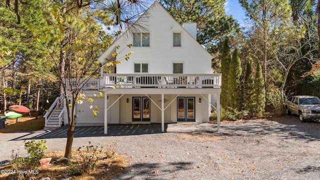 rear view of property with a deck