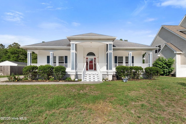 556 Pearson Cir, Newport, NC 28570 - view of front facade featuring covered porch, a front lawn, and roof with shingles